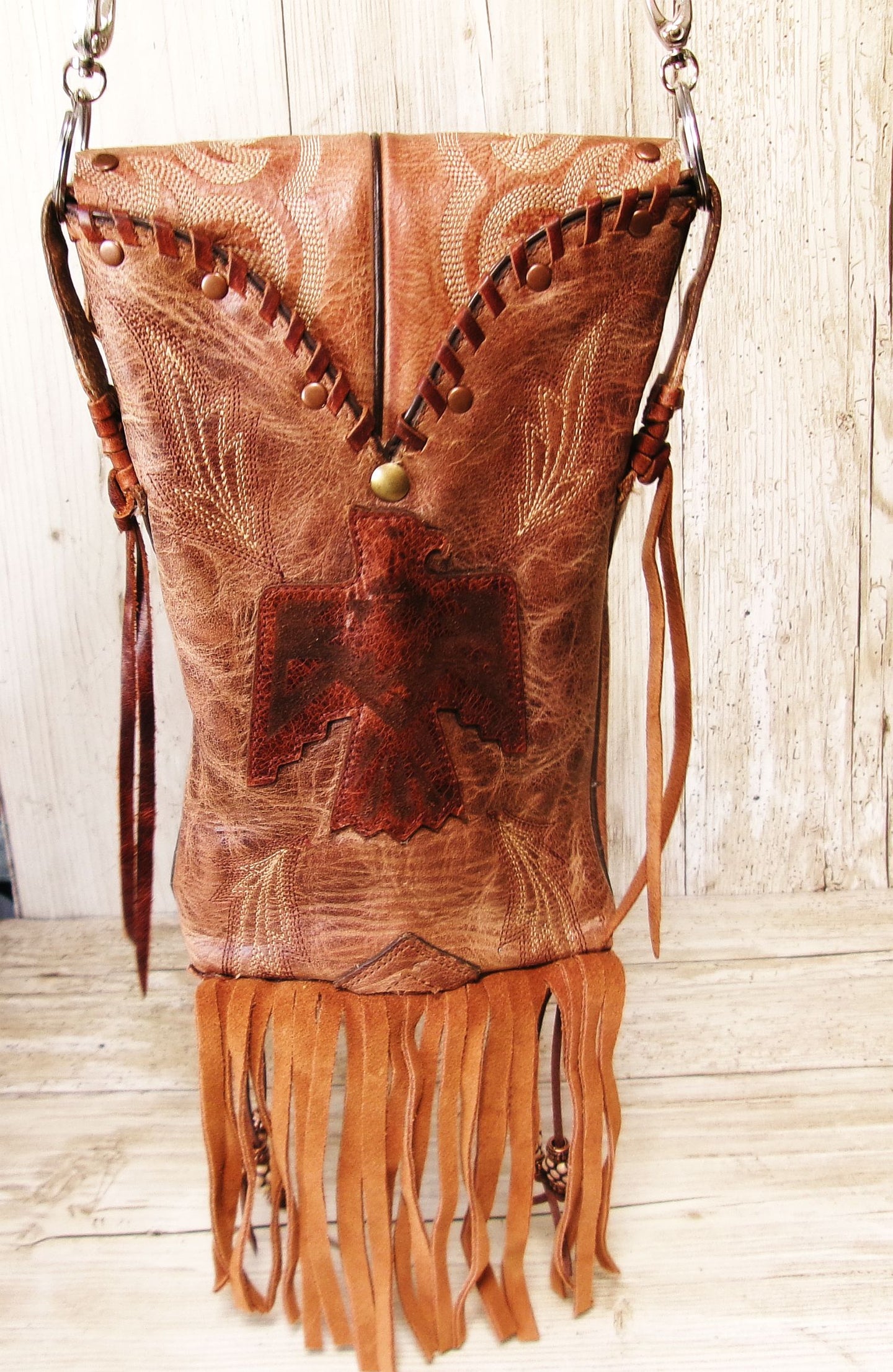 Cowboy Boot Crossbody Hipster Bag with Fringe HP1140 handcrafted from cowboy boots. Shop Handbags at ChrisThompsonBags.com and buy the best ["Crossbody","fringe","Hipster","phoenix","Small","thunderbird"] at Chris Thompson Bags.