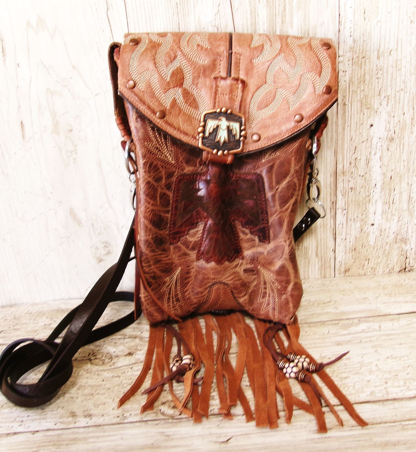 Cowboy Boot Crossbody Hipster Bag with Fringe HP1140 handcrafted from cowboy boots. Shop Handbags at ChrisThompsonBags.com and buy the best ["Crossbody","fringe","Hipster","phoenix","Small","thunderbird"] at Chris Thompson Bags.