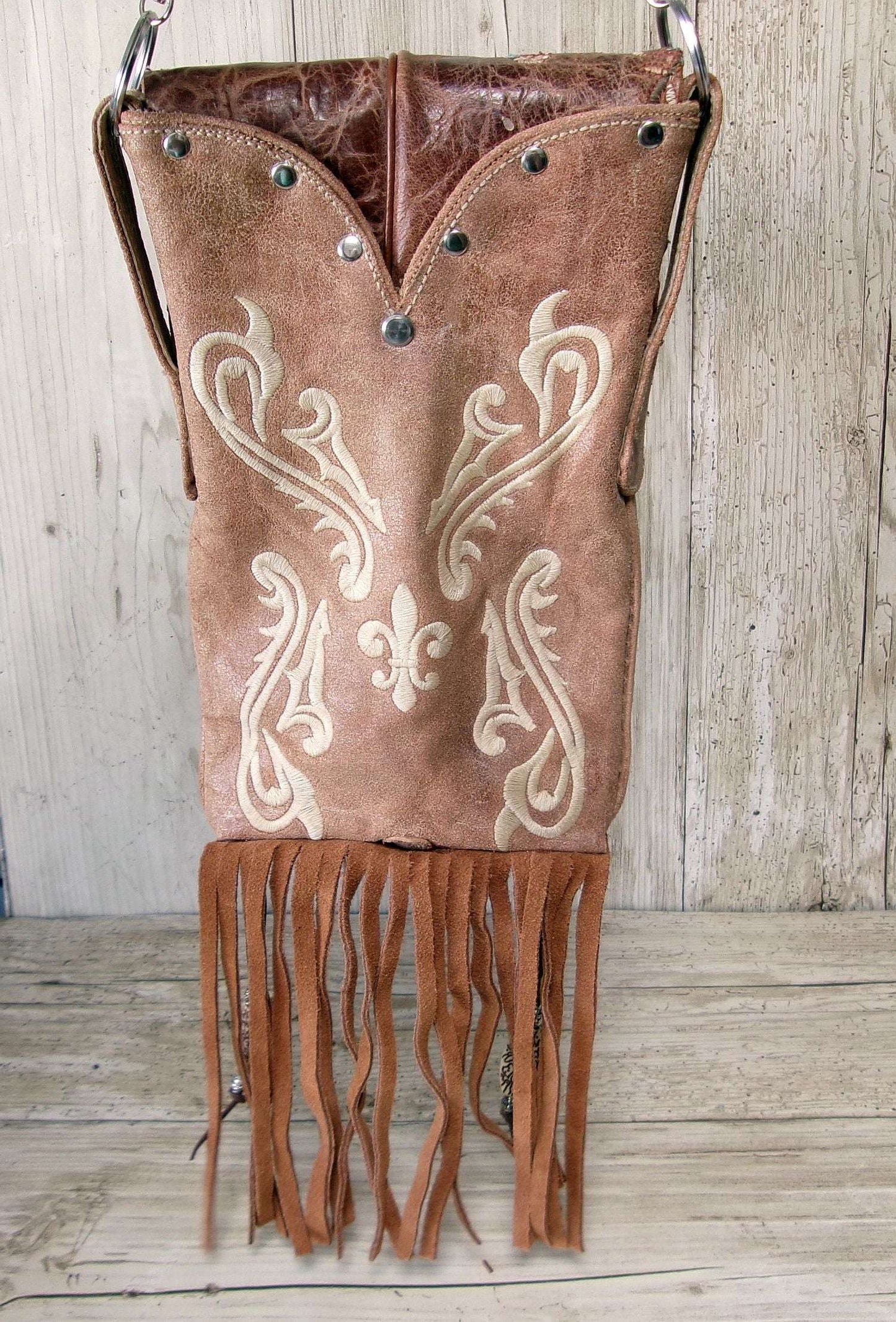 Cowboy Boot Crossbody Hipster Bag with Fringe HP1146 handcrafted from cowboy boots. Shop Handbags at ChrisThompsonBags.com and buy the best ["Crossbody","flowers","fringe","Hipster","Small"] at Chris Thompson Bags.
