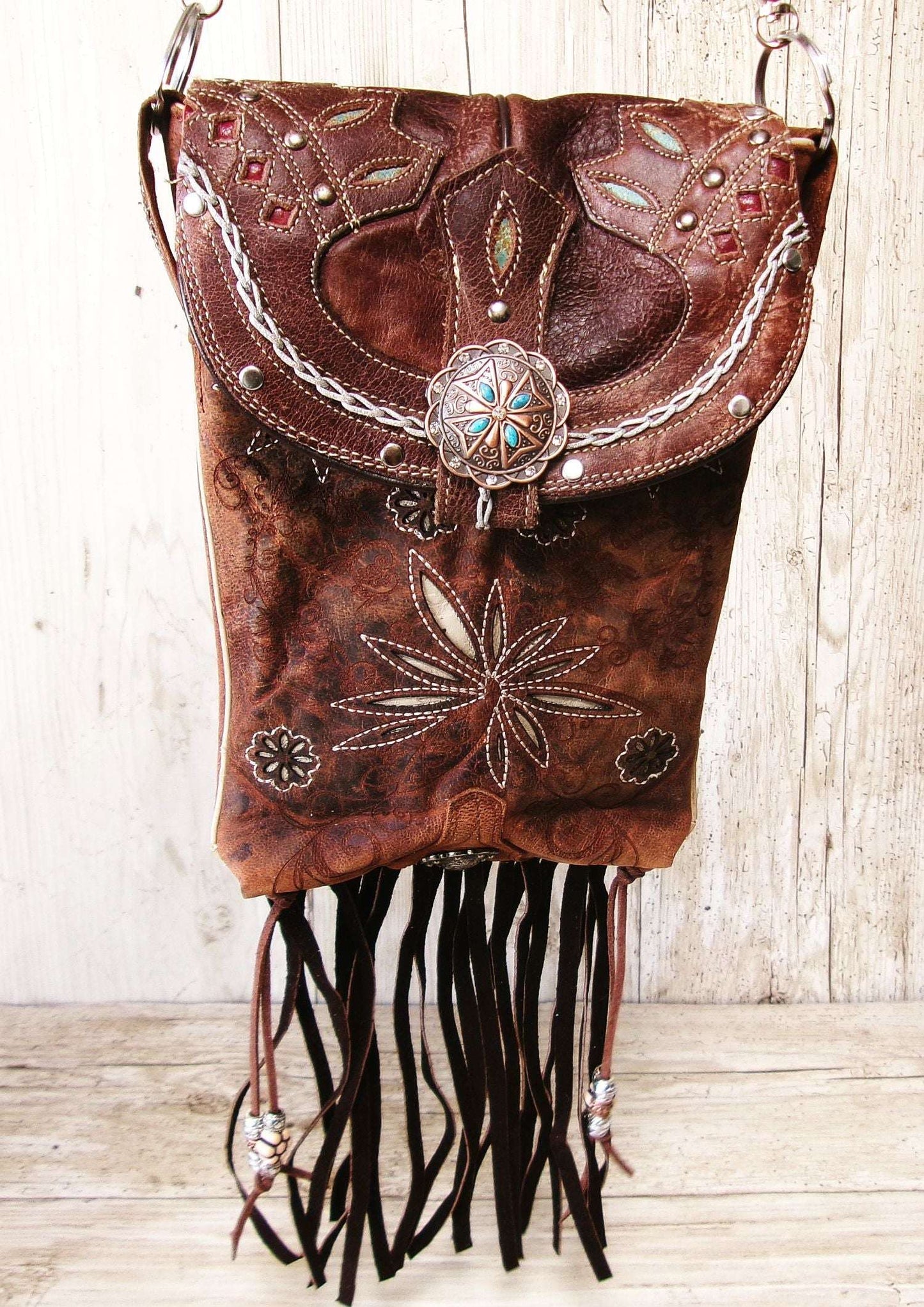 Cowboy Boot Crossbody Hipster Bag with Fringe HP1147 handcrafted from cowboy boots. Shop Handbags at ChrisThompsonBags.com and buy the best ["Crossbody","flowers","fringe","Hipster","Small"] at Chris Thompson Bags.
