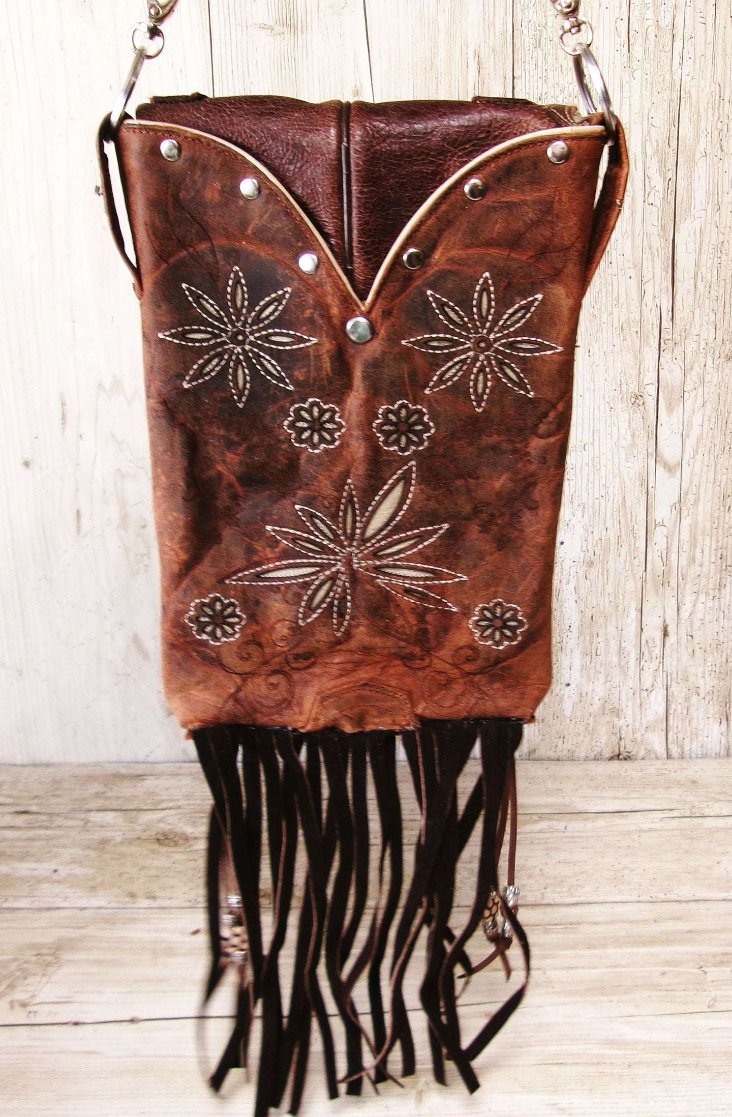 Cowboy Boot Crossbody Hipster Bag with Fringe HP1147 handcrafted from cowboy boots. Shop Handbags at ChrisThompsonBags.com and buy the best ["Crossbody","flowers","fringe","Hipster","Small"] at Chris Thompson Bags.