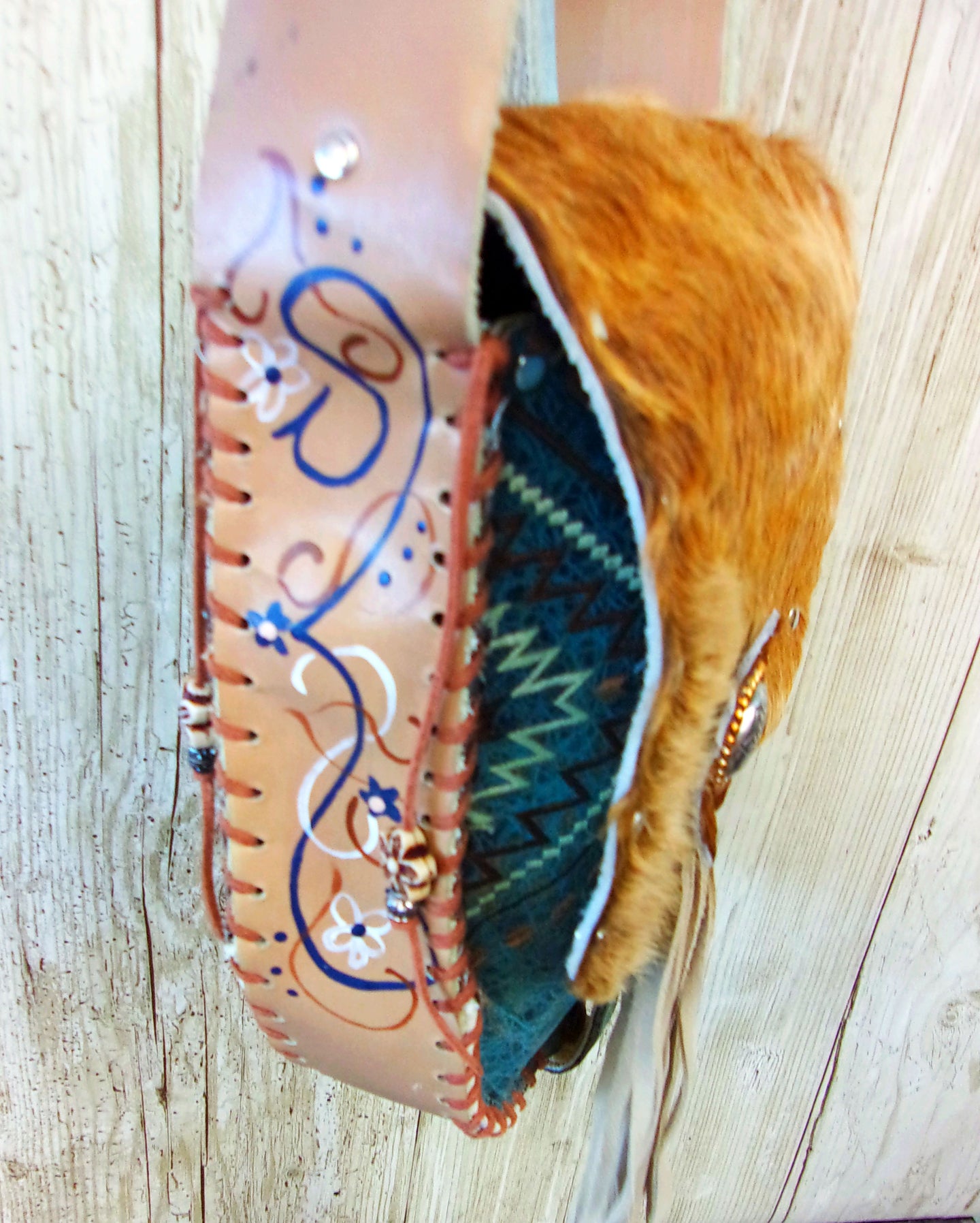 Hand-Painted Boho Bag P02 handcrafted from cowboy boots. Shop Handbags at ChrisThompsonBags.com and buy the best boho purse, boot purse, boot top purse, Country Chic, country fashion, cowboy boot lover, cowboy boot purse, cowboy boot purses, Cowgirl Chic, cowgirl gift, cowgirl hippie bag, cowgirl style, cowhide purse, hair on hide purse, purse with fringe, unique gift for her at Chris Thompson Bags.