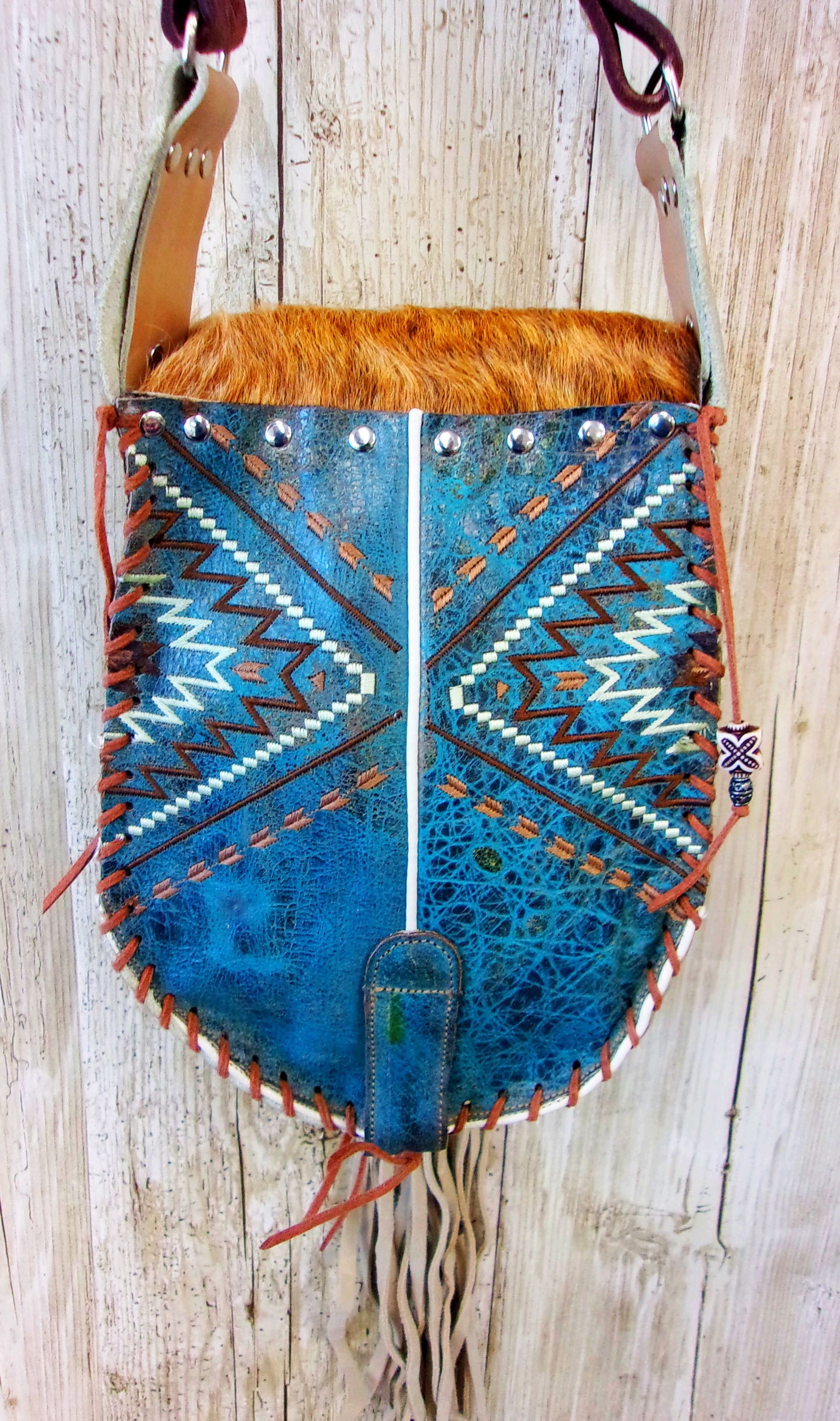 Hand-Painted Boho Bag P02 handcrafted from cowboy boots. Shop Handbags at ChrisThompsonBags.com and buy the best boho purse, boot purse, boot top purse, Country Chic, country fashion, cowboy boot lover, cowboy boot purse, cowboy boot purses, Cowgirl Chic, cowgirl gift, cowgirl hippie bag, cowgirl style, cowhide purse, hair on hide purse, purse with fringe, unique gift for her at Chris Thompson Bags.