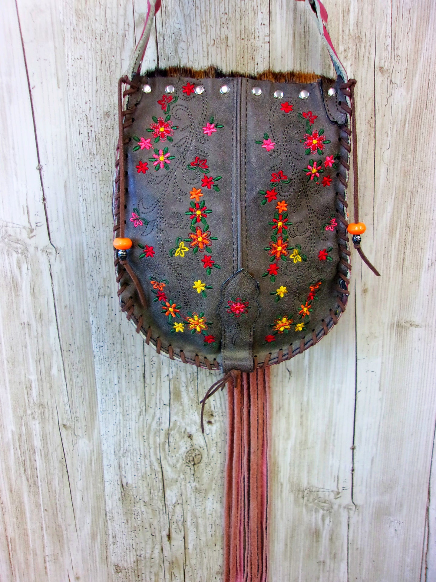 Hand-Painted Boho Bag P03 handcrafted from cowboy boots. Shop Handbags at ChrisThompsonBags.com and buy the best boho purse, boot purse, boot top purse, Country Chic, country fashion, cowboy boot lover, cowboy boot purse, cowboy boot purses, Cowgirl Chic, cowgirl gift, cowgirl hippie bag, cowgirl style, cowhide purse, hair on hide purse, purse with fringe, unique gift for her at Chris Thompson Bags.