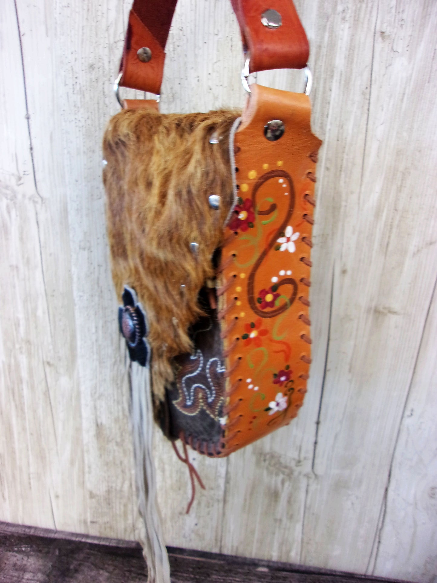 Hand-Painted Boho Bag P04 handcrafted from cowboy boots. Shop Handbags at ChrisThompsonBags.com and buy the best boho purse, boot purse, boot top purse, Country Chic, country fashion, cowboy boot lover, cowboy boot purse, cowboy boot purses, Cowgirl Chic, cowgirl gift, cowgirl hippie bag, cowgirl style, cowhide purse, hair on hide purse, purse with fringe, unique gift for her at Chris Thompson Bags.