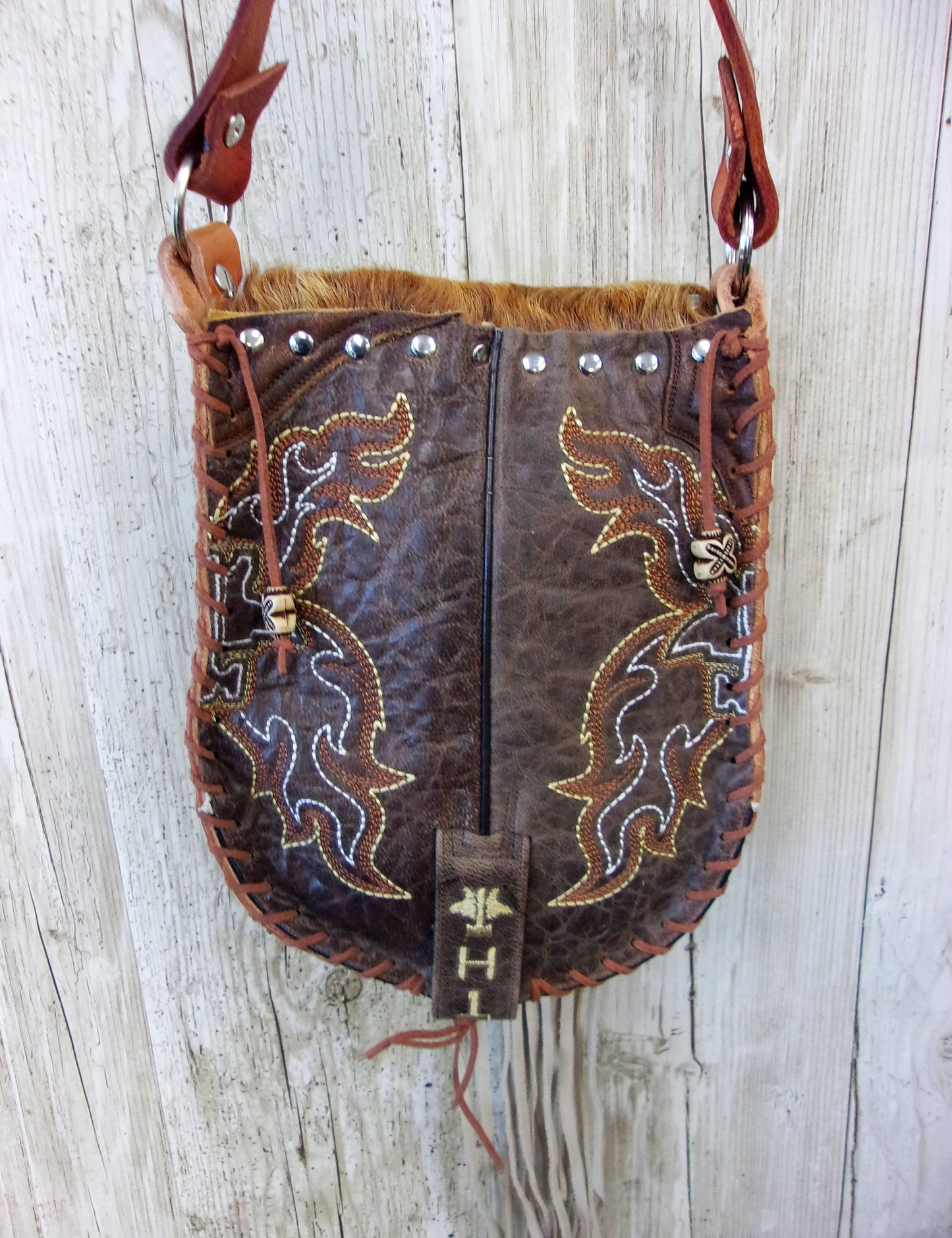 Hand-Painted Boho Bag P04 handcrafted from cowboy boots. Shop Handbags at ChrisThompsonBags.com and buy the best boho purse, boot purse, boot top purse, Country Chic, country fashion, cowboy boot lover, cowboy boot purse, cowboy boot purses, Cowgirl Chic, cowgirl gift, cowgirl hippie bag, cowgirl style, cowhide purse, hair on hide purse, purse with fringe, unique gift for her at Chris Thompson Bags.