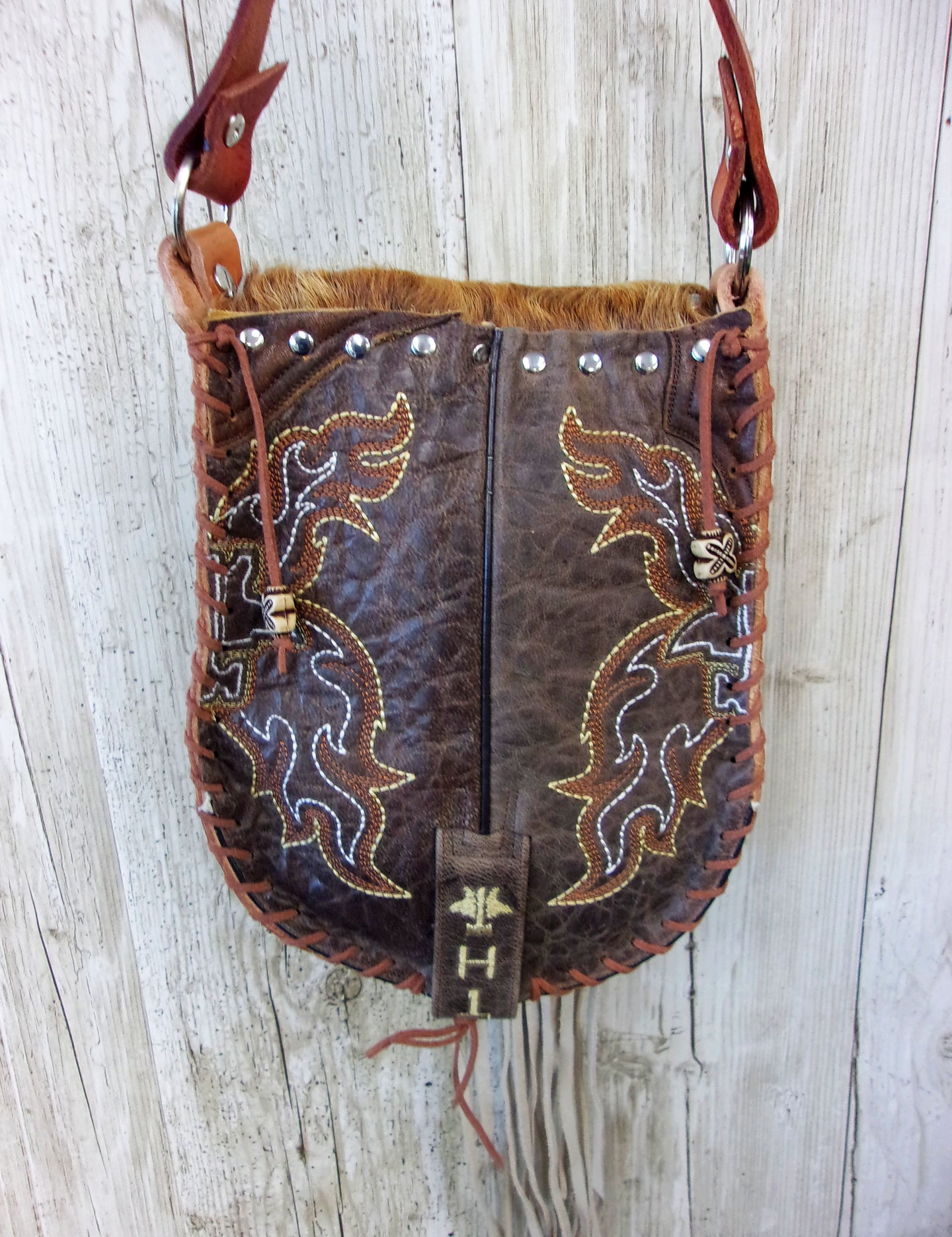 Hand-Painted Boho Bag P04 handcrafted from cowboy boots. Shop Handbags at ChrisThompsonBags.com and buy the best boho purse, boot purse, boot top purse, Country Chic, country fashion, cowboy boot lover, cowboy boot purse, cowboy boot purses, Cowgirl Chic, cowgirl gift, cowgirl hippie bag, cowgirl style, cowhide purse, hair on hide purse, purse with fringe, unique gift for her at Chris Thompson Bags.