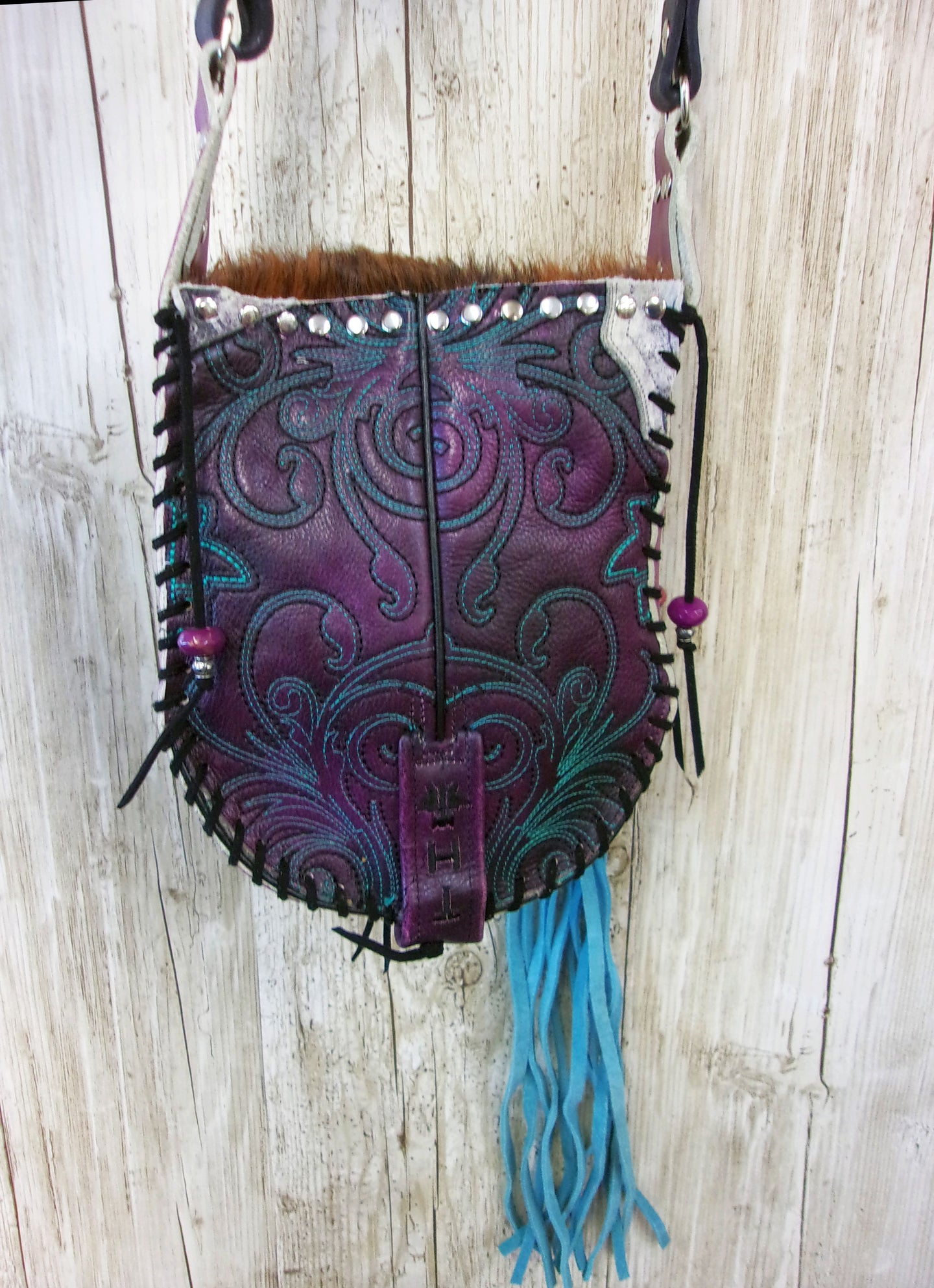 Hand-Painted Boho Bag P05 handcrafted from cowboy boots. Shop Handbags at ChrisThompsonBags.com and buy the best boho purse, boot purse, boot top purse, Country Chic, country fashion, cowboy boot lover, cowboy boot purse, cowboy boot purses, Cowgirl Chic, cowgirl gift, cowgirl hippie bag, cowgirl style, cowhide purse, hair on hide purse, purse with fringe, unique gift for her at Chris Thompson Bags.