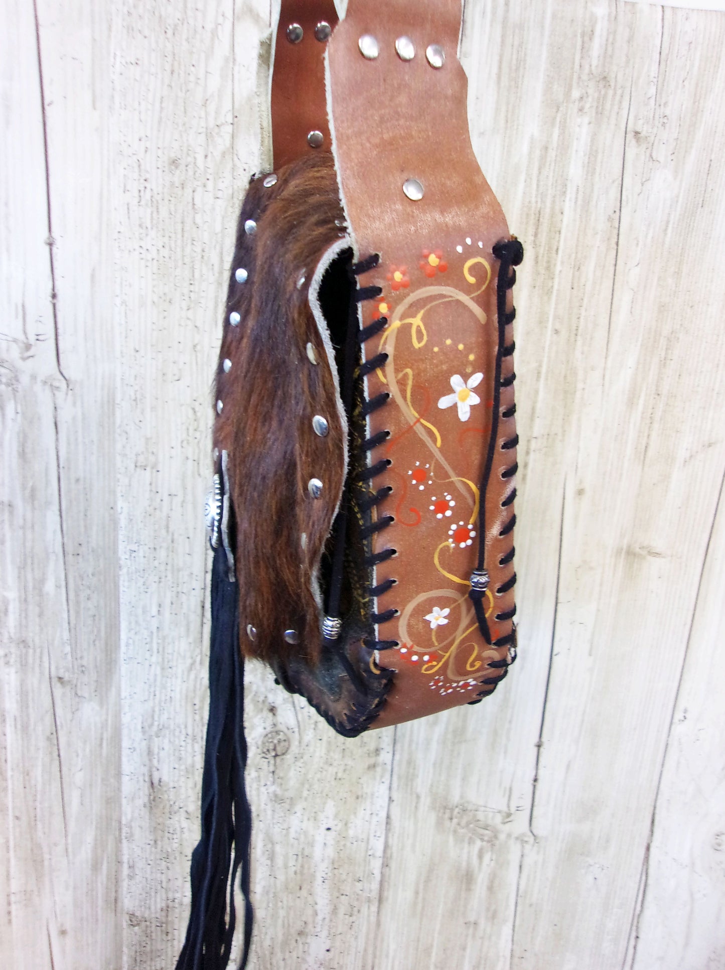 Hand-Painted Boho Bag P07 handcrafted from cowboy boots. Shop Handbags at ChrisThompsonBags.com and buy the best boho purse, boot purse, boot top purse, Country Chic, country fashion, cowboy boot lover, cowboy boot purse, cowboy boot purses, Cowgirl Chic, cowgirl gift, cowgirl hippie bag, cowgirl style, cowhide purse, hair on hide purse, purse with fringe, unique gift for her at Chris Thompson Bags.