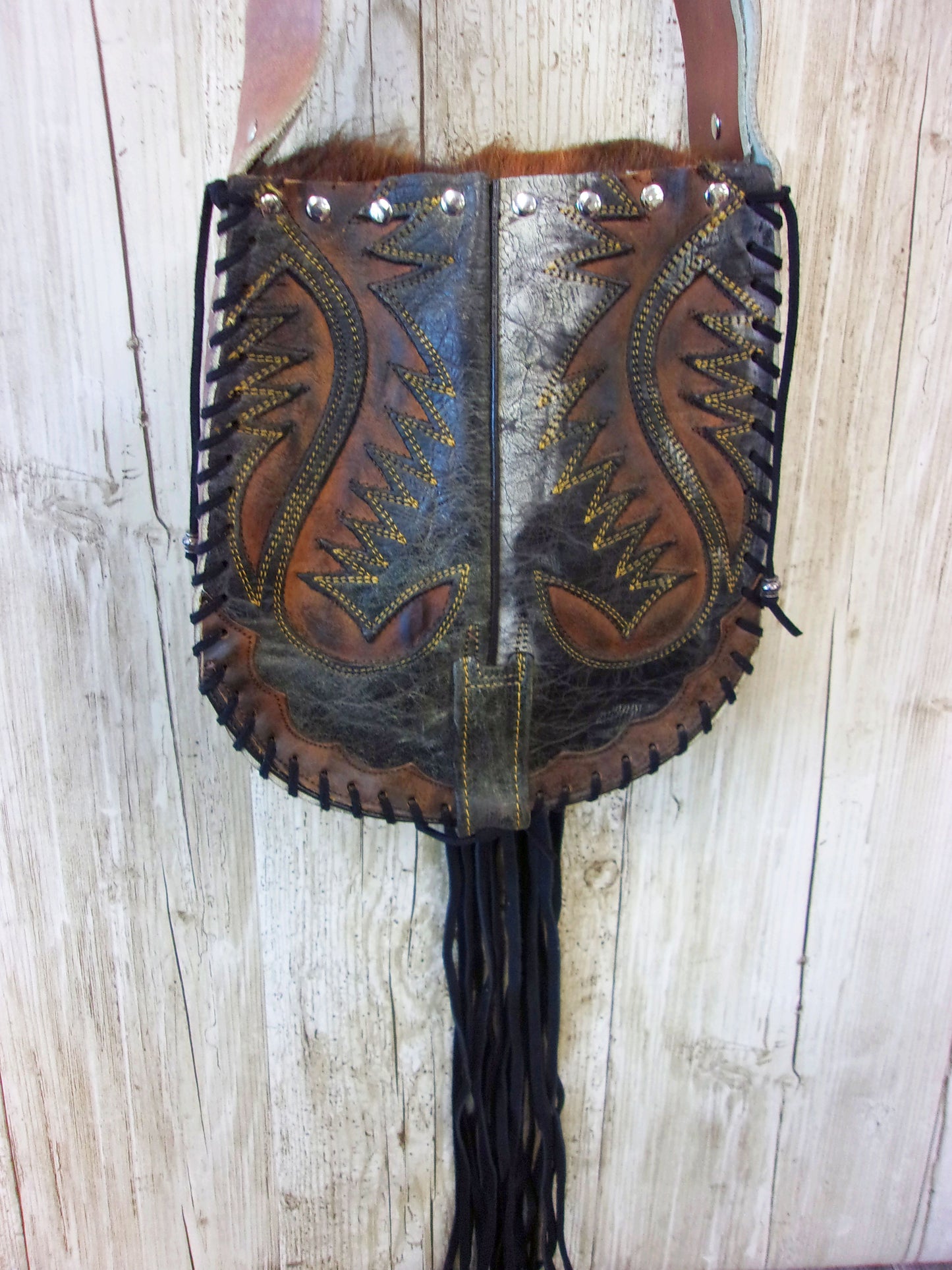 Hand-Painted Boho Bag P07 handcrafted from cowboy boots. Shop Handbags at ChrisThompsonBags.com and buy the best boho purse, boot purse, boot top purse, Country Chic, country fashion, cowboy boot lover, cowboy boot purse, cowboy boot purses, Cowgirl Chic, cowgirl gift, cowgirl hippie bag, cowgirl style, cowhide purse, hair on hide purse, purse with fringe, unique gift for her at Chris Thompson Bags.