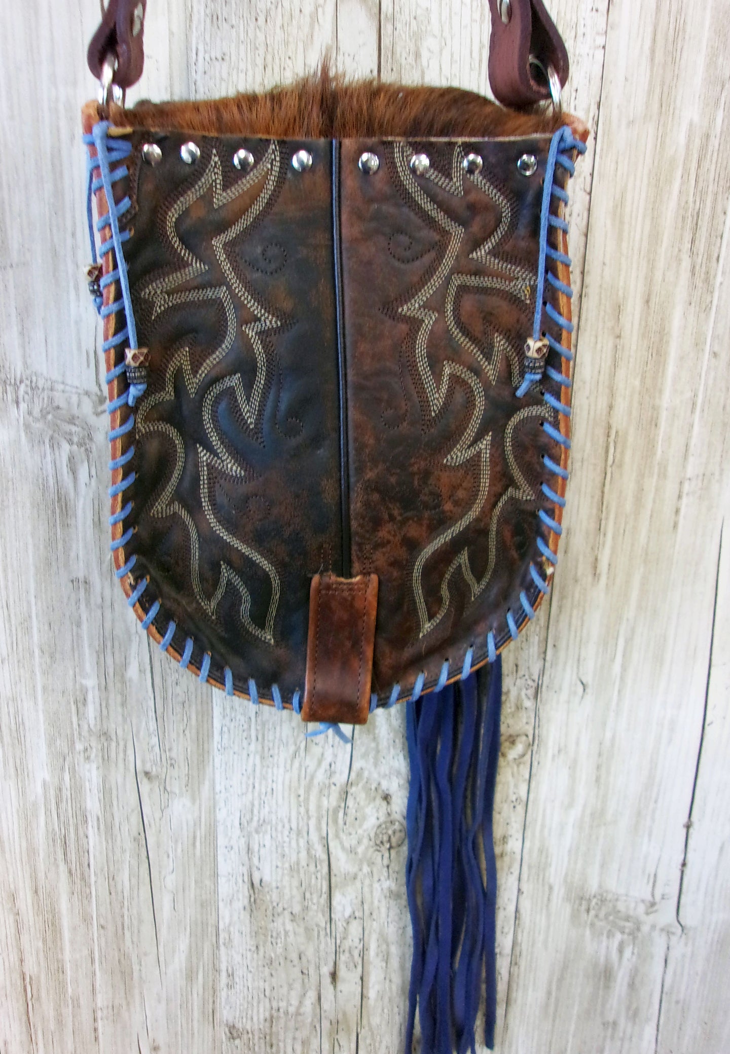 Hand-Painted Boho Bag P08 handcrafted from cowboy boots. Shop Handbags at ChrisThompsonBags.com and buy the best boho purse, boot purse, boot top purse, Country Chic, country fashion, cowboy boot lover, cowboy boot purse, cowboy boot purses, Cowgirl Chic, cowgirl gift, cowgirl hippie bag, cowgirl style, cowhide purse, hair on hide purse, purse with fringe, unique gift for her at Chris Thompson Bags.