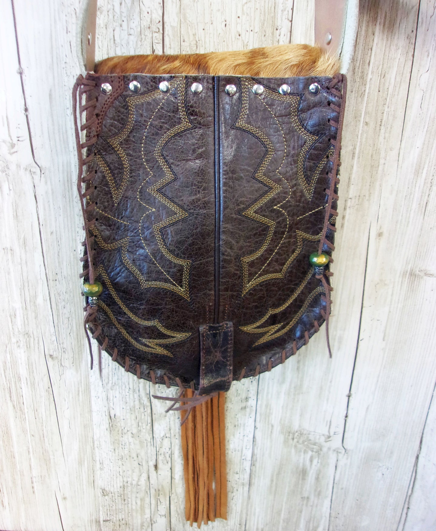 Hand-Painted Boho Bag P09 handcrafted from cowboy boots. Shop Handbags at ChrisThompsonBags.com and buy the best boho purse, boot purse, boot top purse, Country Chic, country fashion, cowboy boot lover, cowboy boot purse, cowboy boot purses, Cowgirl Chic, cowgirl gift, cowgirl hippie bag, cowgirl style, cowhide purse, hair on hide purse, purse with fringe, unique gift for her at Chris Thompson Bags.