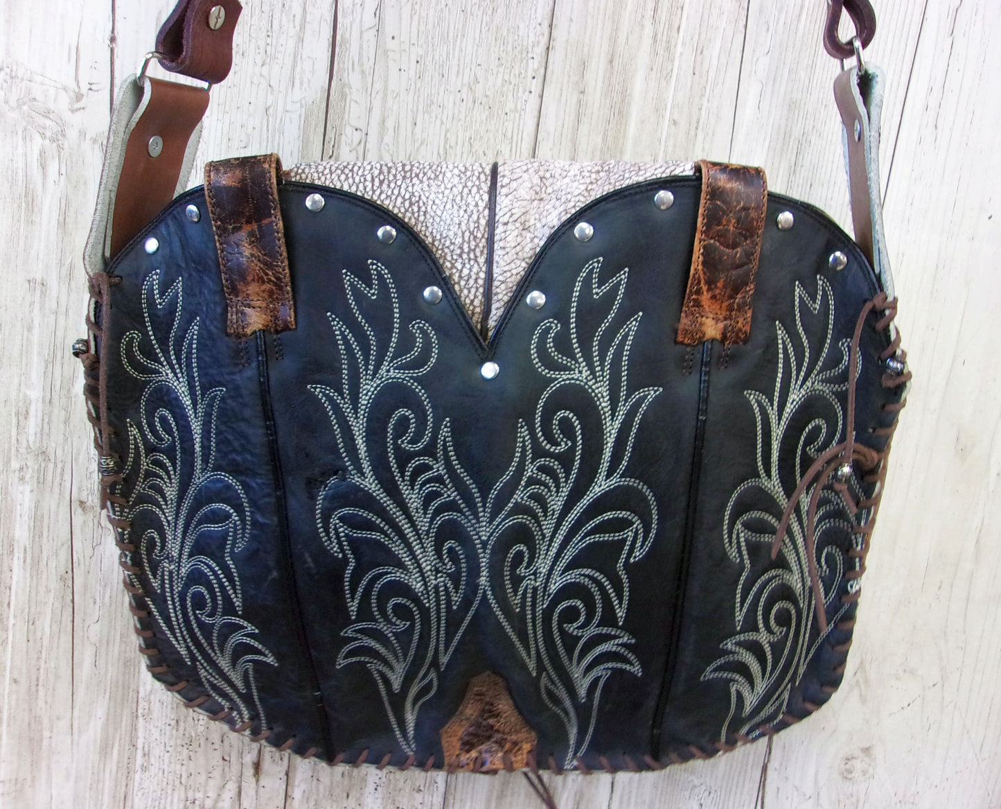 Hand-Painted Boho Bag P014 handcrafted from cowboy boots. Shop Handbags at ChrisThompsonBags.com and buy the best boho purse, boot purse, boot top purse, Country Chic, country fashion, cowboy boot lover, cowboy boot purse, cowboy boot purses, Cowgirl Chic, cowgirl gift, cowgirl hippie bag, cowgirl style, cowhide purse, hair on hide purse, purse with fringe, unique gift for her at Chris Thompson Bags.