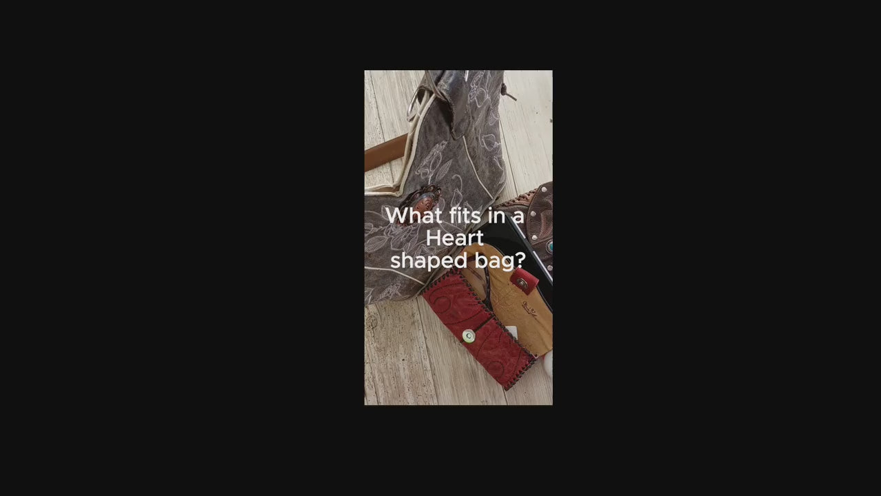 Load video: all the things that fit in a heart shaped bag
