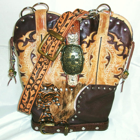Decorative leather bag with intricate patterns and embellishments on a white background