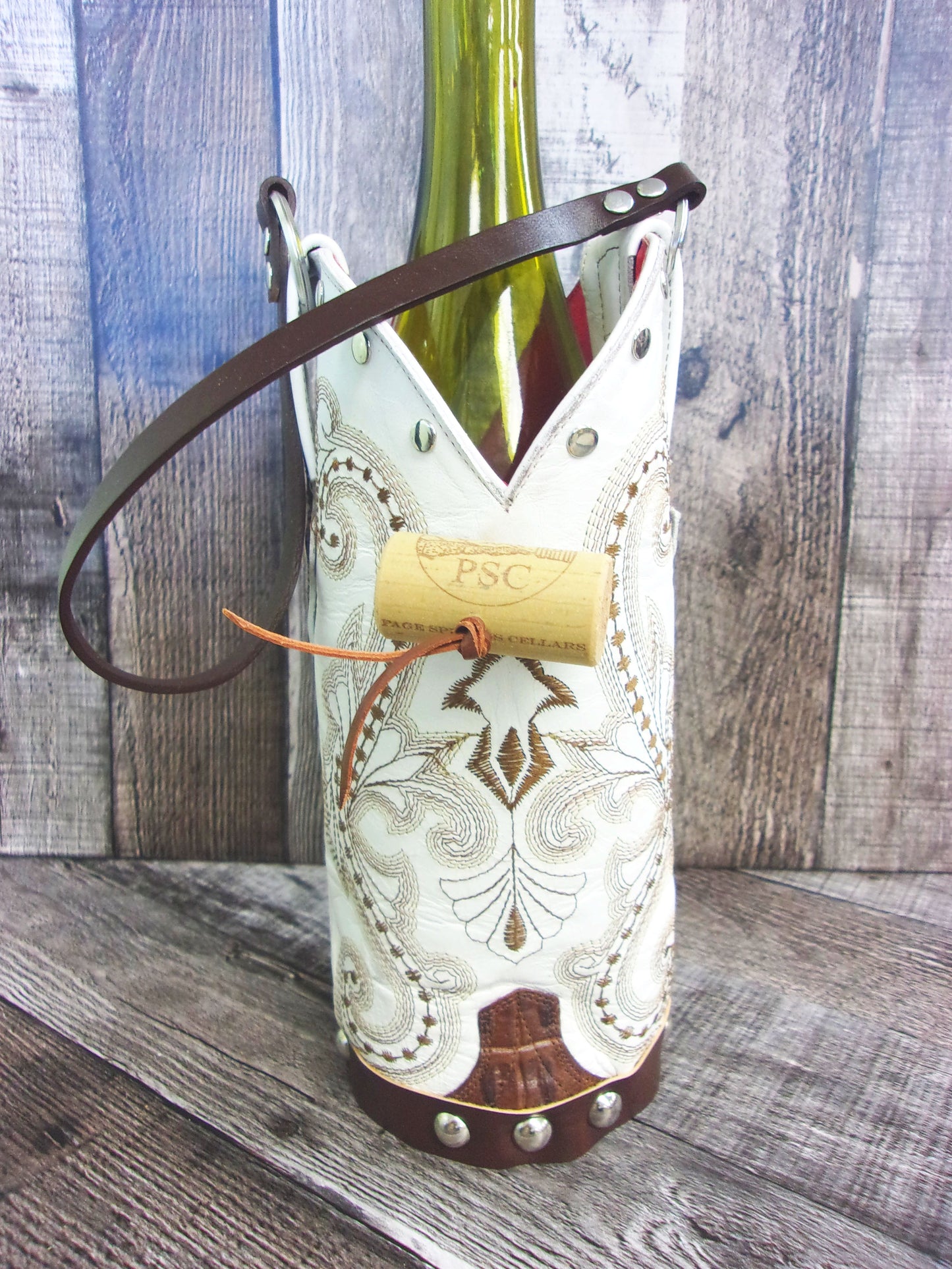 Cowboy Boot Wine Tote wt852 handcrafted from cowboy boots. Shop Wine Carrier Bags at ChrisThompsonBags.com and buy the best country bridesmaid, country centerpiece, country wedding, cowboy gift, cowgirl centerpiece, cowgirl gift, cowgirl wine bag, rodeo party bag, rustic wine carrier, unique western gift, western wine tote, wine lovers gift at Chris Thompson Bags.